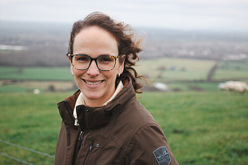 Alison in Mid Sussex with hills behind