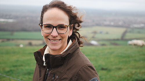 Alison in Mid Sussex with hills behind