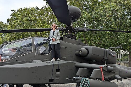 Alison next to a helicopter