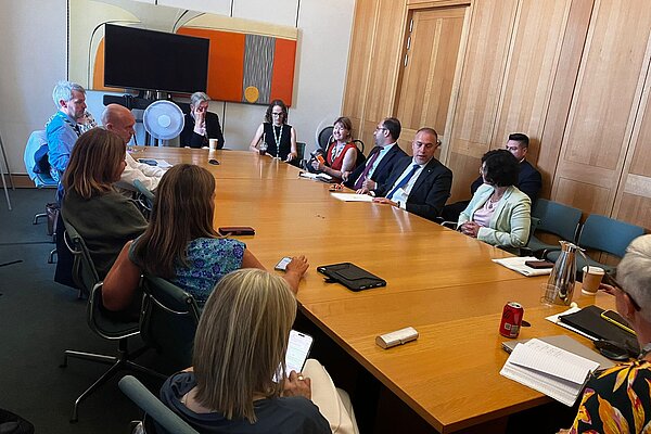 Liberal Democrat MPs sitting with Palestinian Ambassador